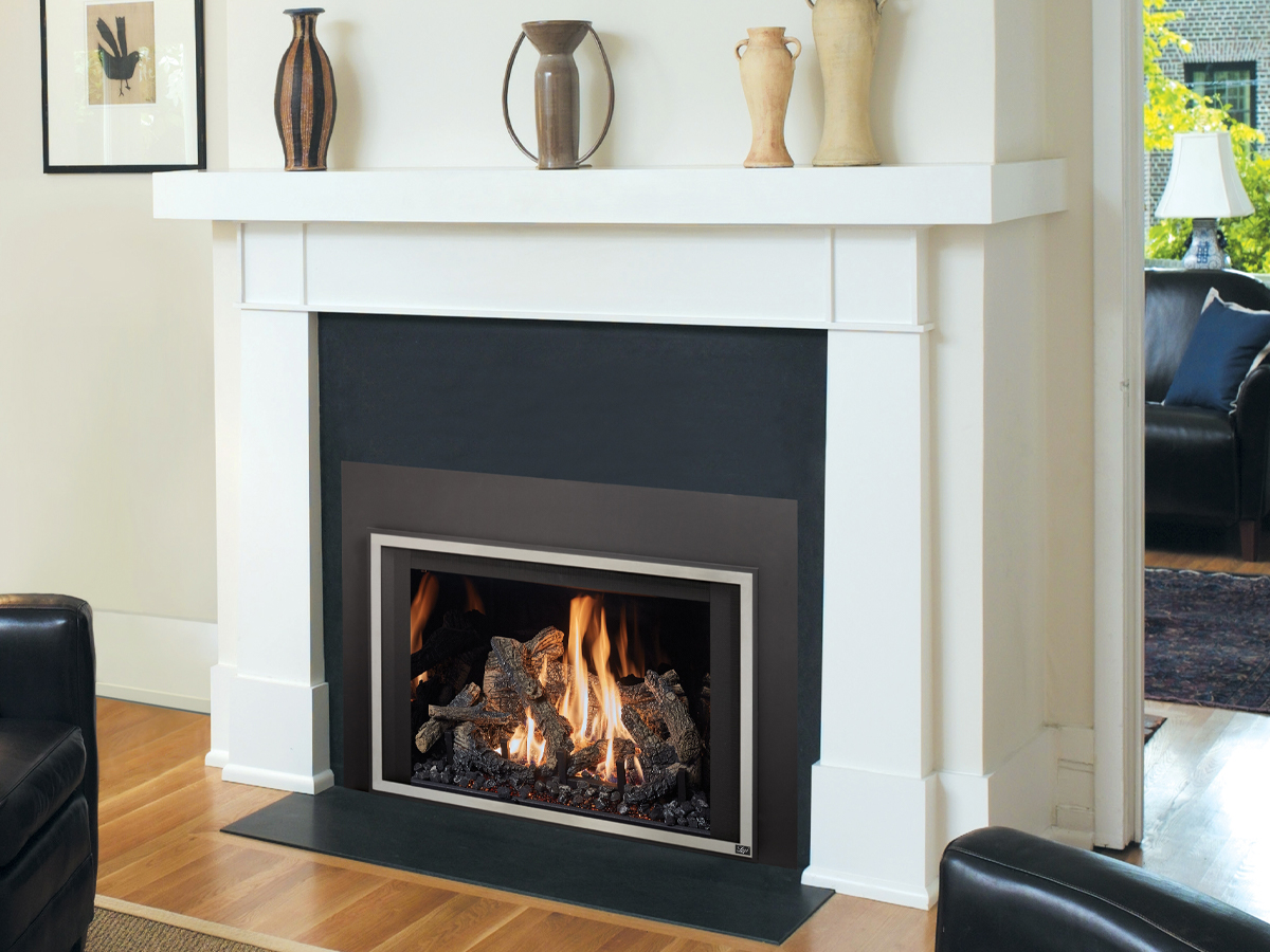 Gas fireplace insert paired with a white mantel