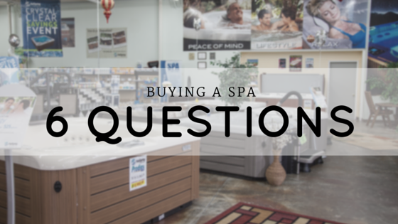 spa showroom with overlaid text - buying a spa - six questions to ask