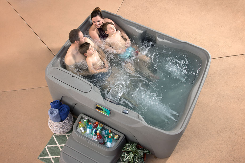 Family of four relaxing in Hot Tub